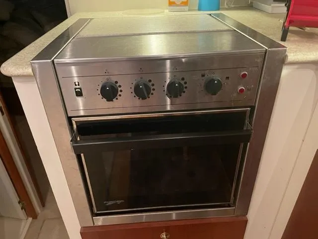 Slide: The Image of Stainless steel oven in a 1999 Silverton 392 Motor Yacht kitchen. - 28