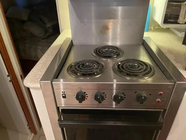 Slide: The Image of Stainless steel stove in 1999 Silverton 392 Motor Yacht kitchen area. - 29