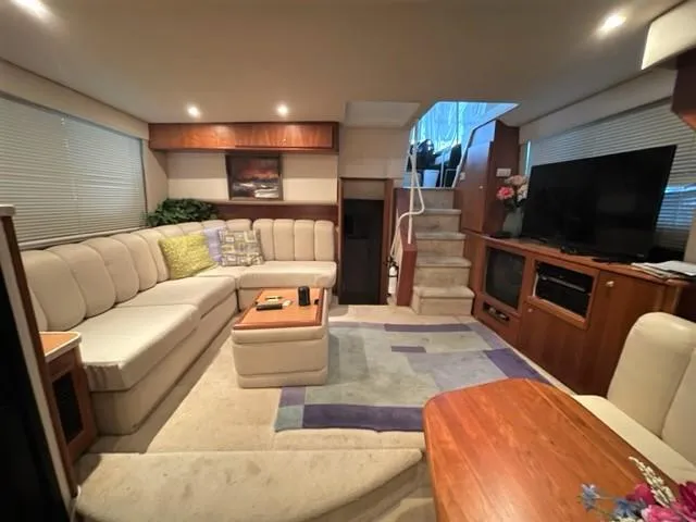 Slide: The Image of Luxurious interior of a 1999 Silverton 392 Motor Yacht with plush seating and modern amenities. - 31
