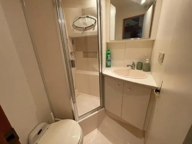 Slide: The Image of Bathroom interior of 1999 Silverton 392 Motor Yacht with shower and sink. - 40