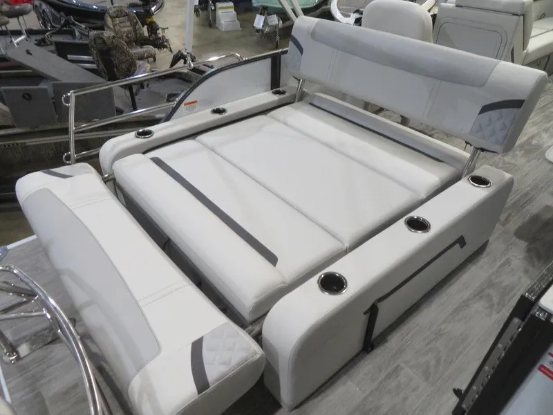 Slide: The Image of 2024 Crest Classic DLX 240 SLSC boat interior with luxurious white seating. - 10
