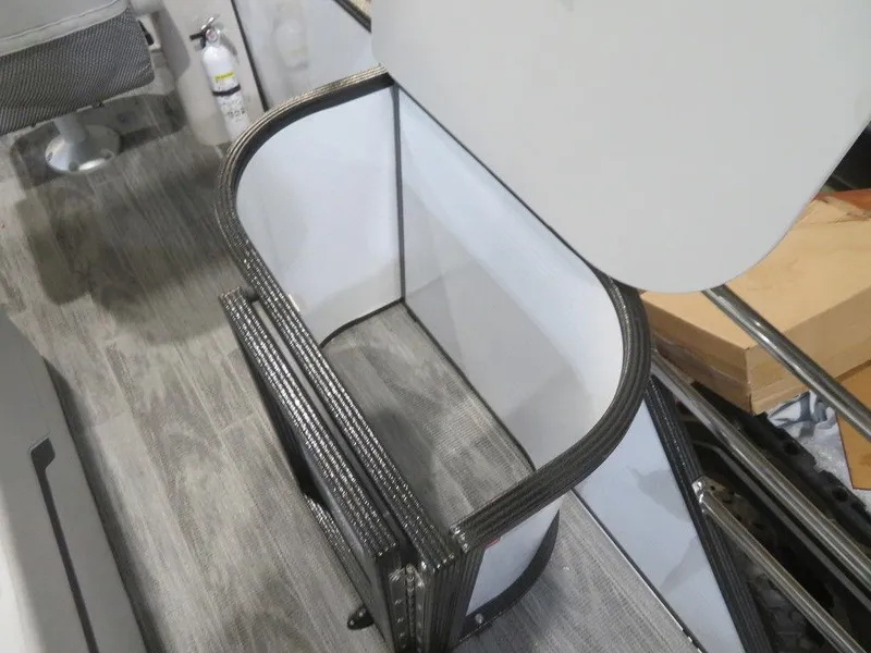 Slide: The Image of Storage compartment in 2024 Crest Classic DLX 240 SLSC boat with wood flooring. - 15