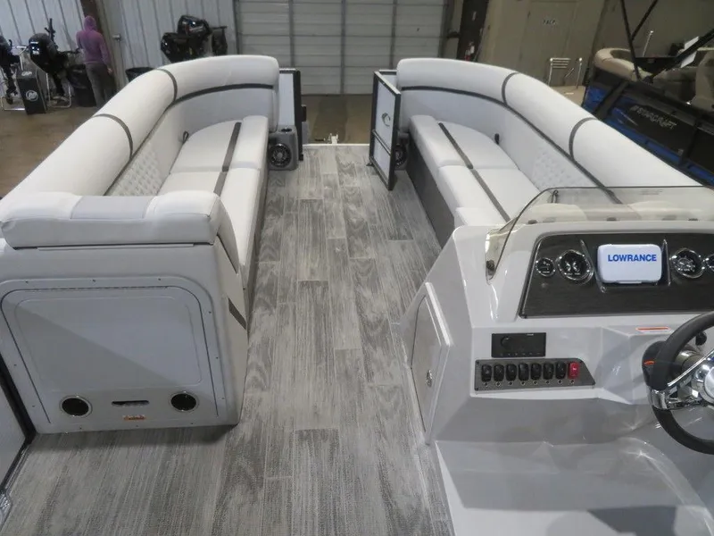 Slide: The Image of 2024 Crest Classic DLX 240 SLSC pontoon boat interior with spacious seating and modern dashboard. - 5