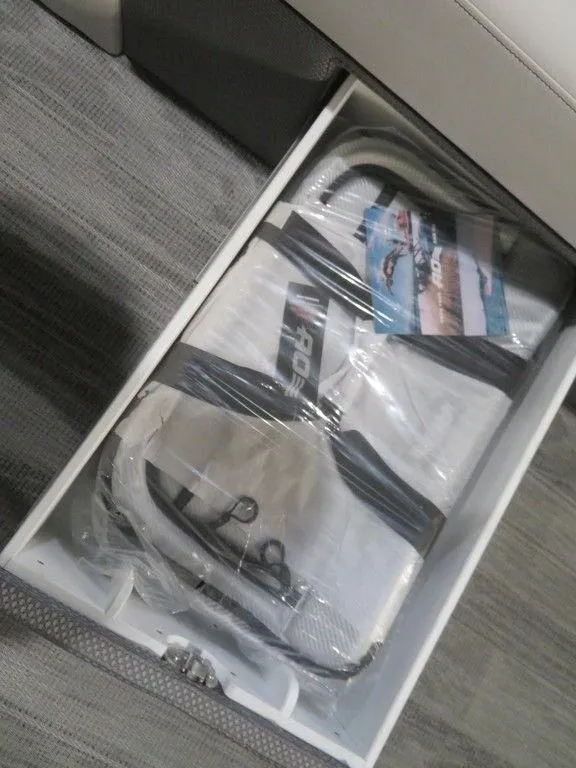 Slide: The Image of Storage compartment in 2024 Crest Classic DLX 240 SLSC boat with life jackets. - 6