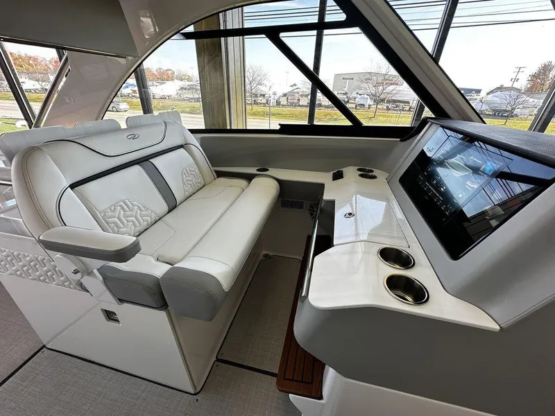 Slide: The Image of 2024 Regal LS36 boat interior with luxurious seating and modern dashboard. - 10
