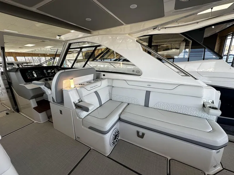 Slide: The Image of 2024 Regal LS36 boat interior with luxurious seating and modern dashboard. - 13