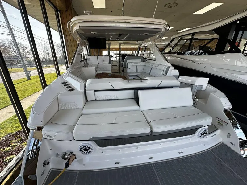 Slide: The Image of 2024 Regal LS36 luxury boat interior with white seating and modern amenities. - 14