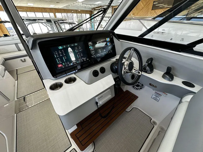 Slide: The Image of 2024 Regal LS36 boat cockpit with modern dashboard and steering wheel. - 15