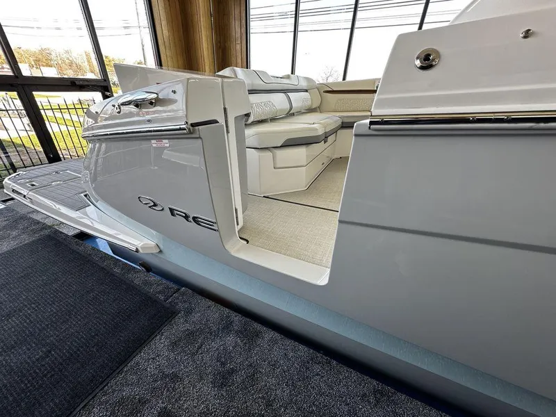 Slide: The Image of 2024 Regal LS36 boat interior with plush seating and modern design. - 16
