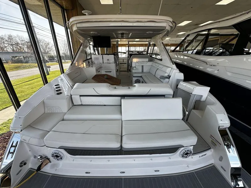 Slide: The Image of 2024 Regal LS36 luxury yacht interior with white seating and modern amenities. - 18