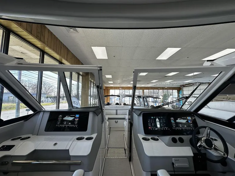 Slide: The Image of 2024 Regal LS36 boat interior with dual helm stations and advanced navigation displays. - 20