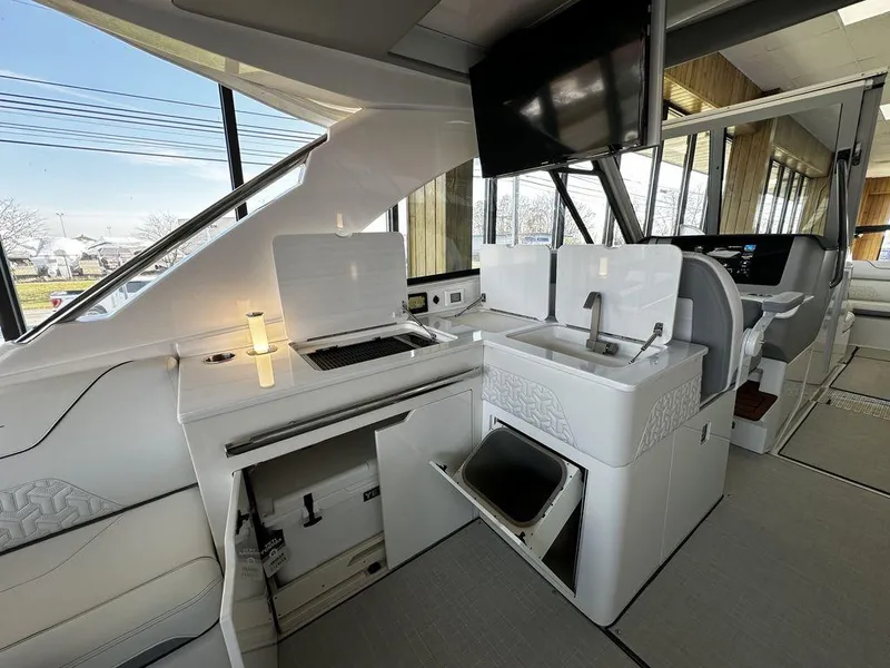 Slide: The Image of 2024 Regal LS36 yacht interior with modern kitchen and sink area. - 26