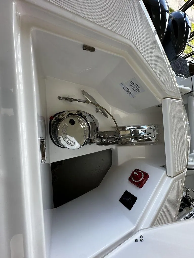 Slide: The Image of 2024 Regal LS36 boat anchor compartment with windlass and control panel. - 6