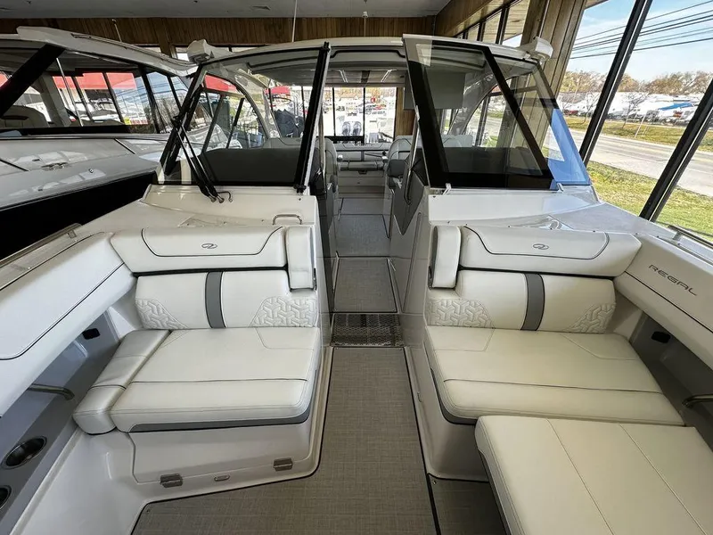 Slide: The Image of 2024 Regal LS36 boat interior with luxurious white seating and modern design. - 7