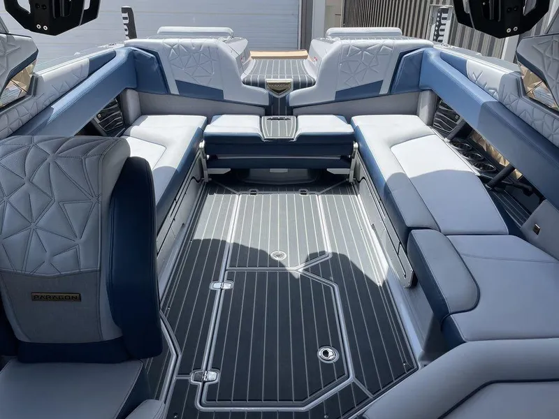 Slide: The Image of Luxurious interior of 2023 Nautique G25 Paragon boat with elegant seating and modern design. - 7