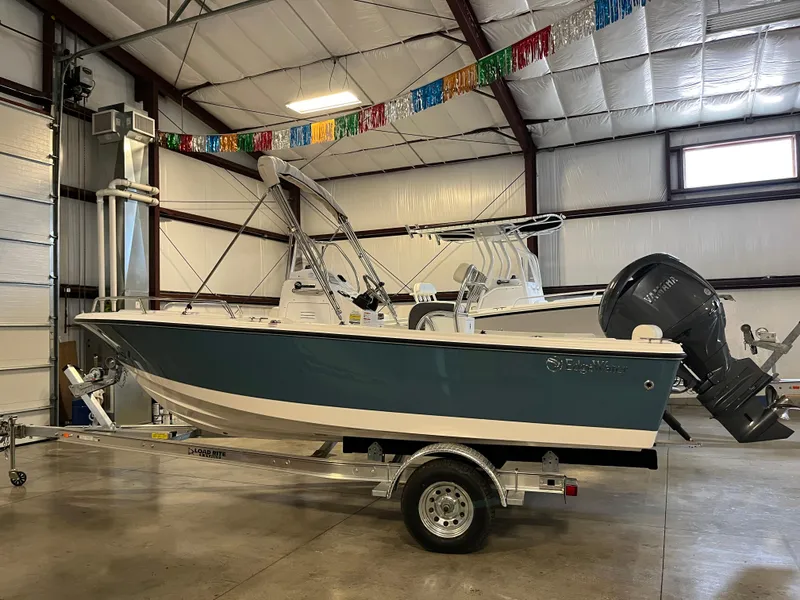 Slide: The Image of 2026 Edgewater 188CC boat in a warehouse, mounted on a trailer. - 10