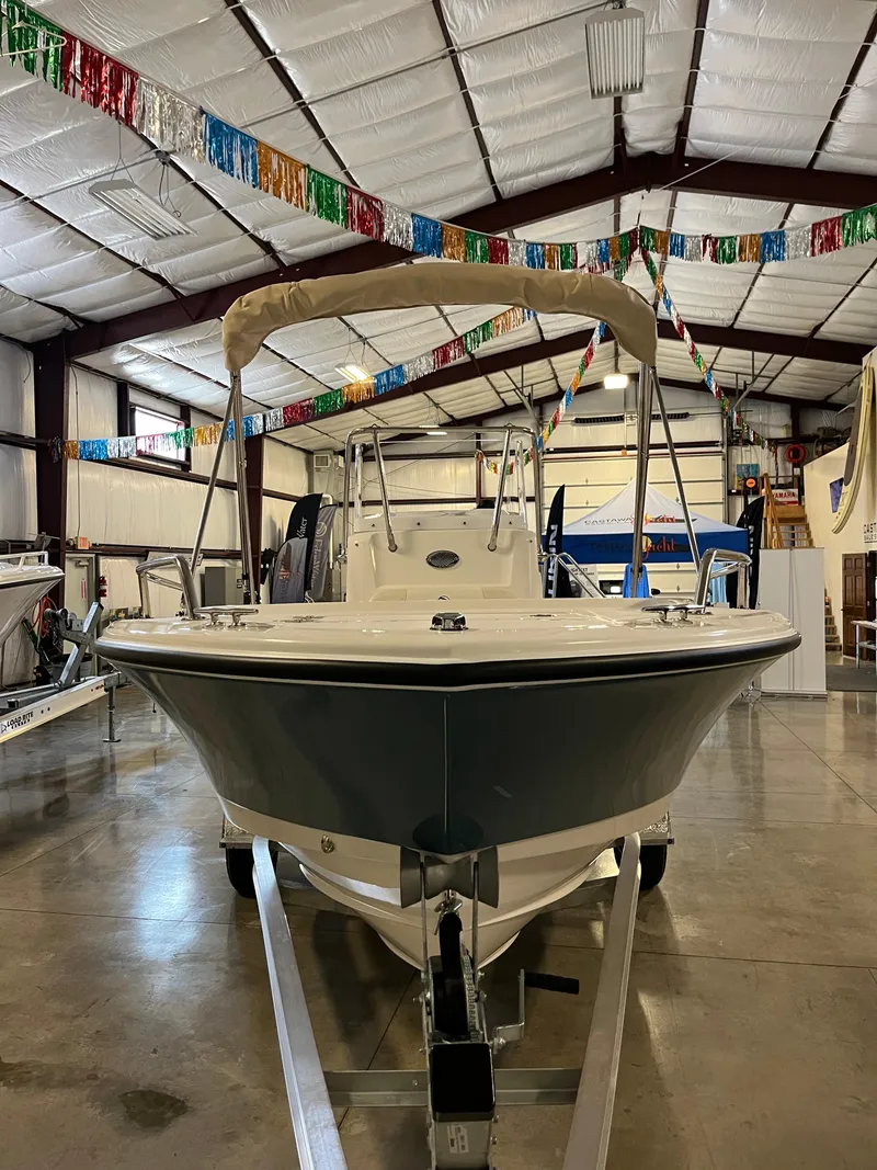 Slide: The Image of 2026 Edgewater 188CC boat displayed in a showroom with festive decorations. - 2