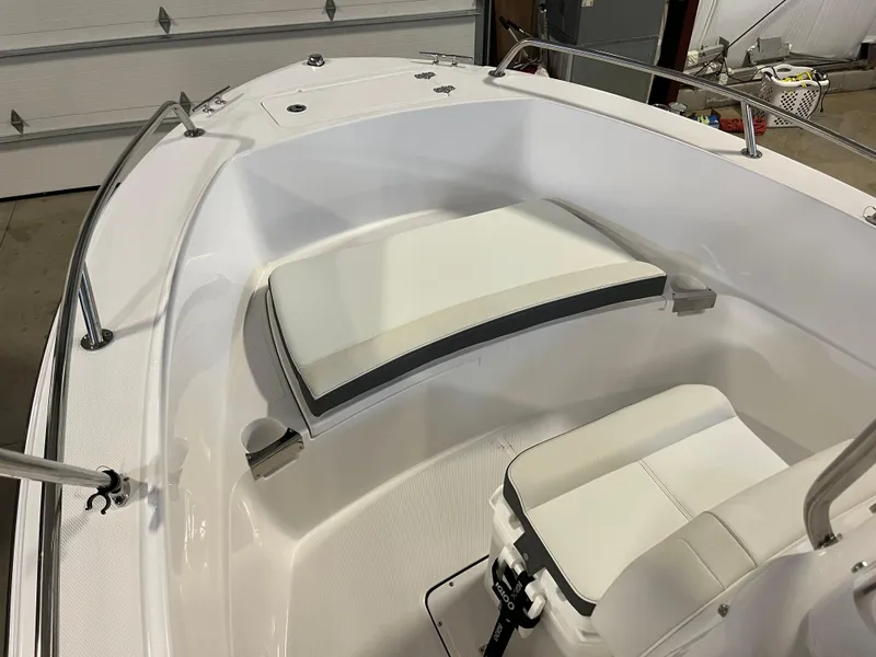 Slide: The Image of 2026 Edgewater 188CC boat interior with white seating and stainless steel railings. - 4