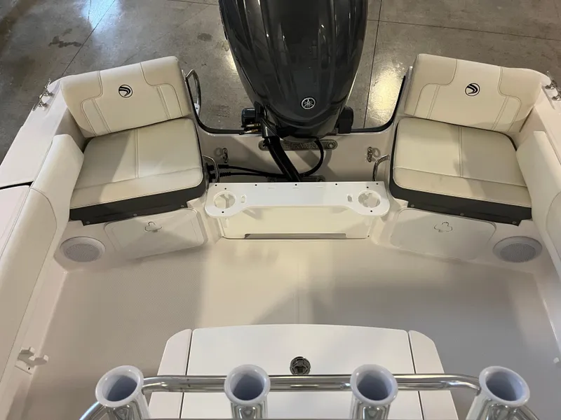 Slide: The Image of 2026 Edgewater 188CC boat interior with cushioned seating and motor, viewed from above. - 8