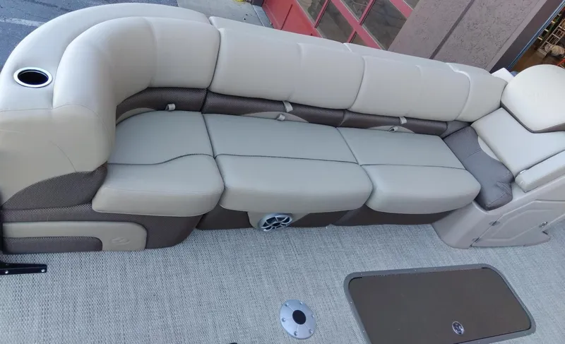 Slide: The Image of 2024 Regency 250 DL3 boat interior with beige seating. - 6