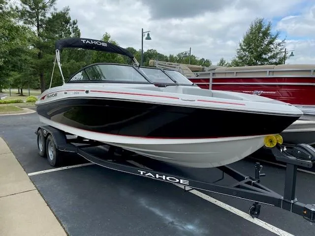 The Image of 2024 Tahoe 210 Si boat on trailer in parking lot. - 0