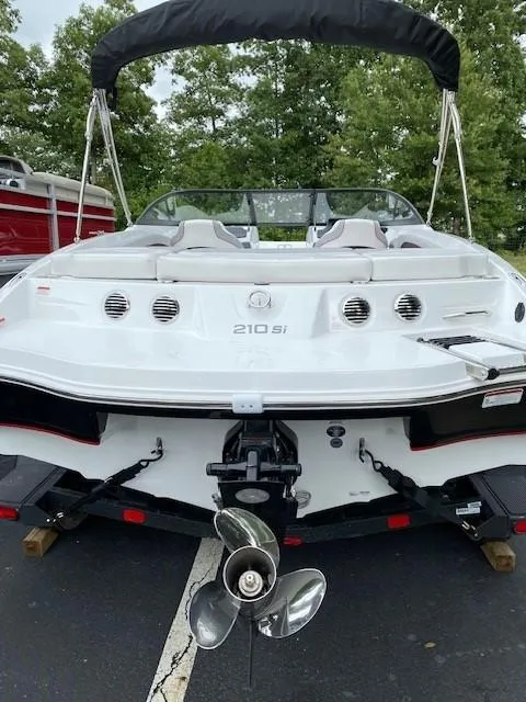 Slide: The Image of 2024 Tahoe 210 Si boat, rear view, on trailer. - 3