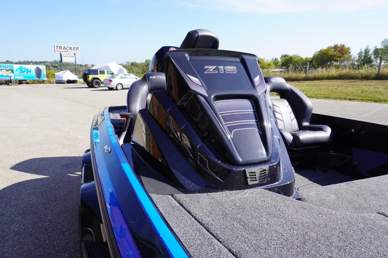 Slide: The Image of 2024 Nitro Z19 boat with sleek design, parked outdoors on a sunny day. - 48