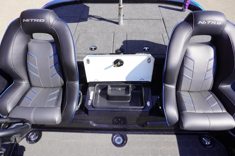 Slide: The Image of 2024 Nitro Z19 boat interior with two black seats and storage compartment. - 53