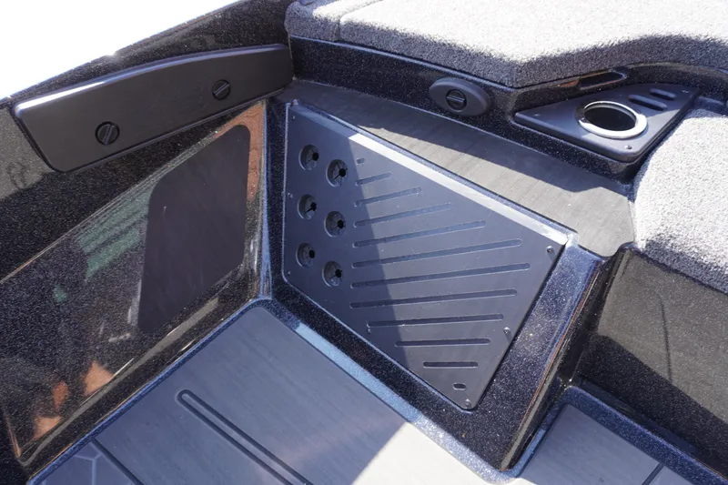 Slide: The Image of 2024 Nitro Z19 boat interior with sleek black panel and cup holder. - 54