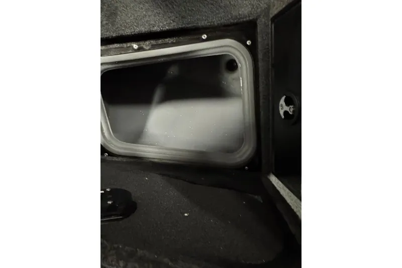 Slide: The Image of Interior compartment of 2018 Tracker Targa V-19 WT boat, featuring storage space. - 15