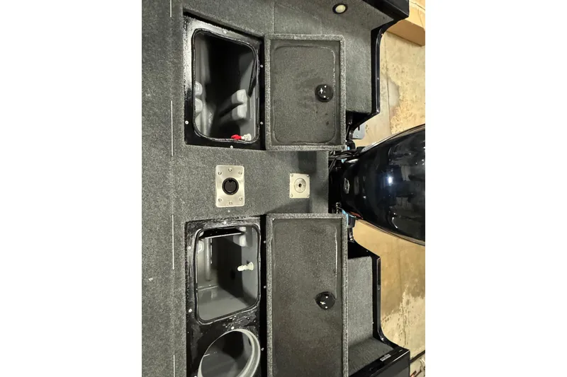 Slide: The Image of 2018 Tracker Targa V-19 WT boat interior compartments and engine view. - 7