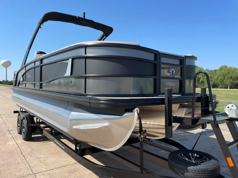 Slide: The Image of 2024 Barletta Lusso 25UCA pontoon boat on a trailer, side view. - 12