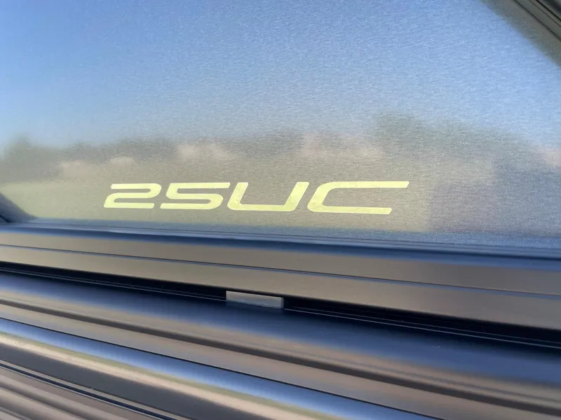 Slide: The Image of Close-up of 2024 Barletta Lusso 25UCA model logo on boat exterior. - 13