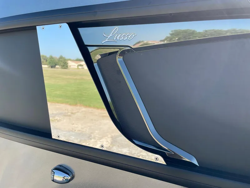 Slide: The Image of 2024 Barletta Lusso 25UCA exterior detail with sleek design and chrome accents. - 15
