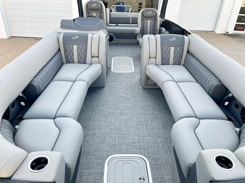 Slide: The Image of 2024 Barletta Lusso 25UCA pontoon boat interior with luxurious seating and modern design. - 20