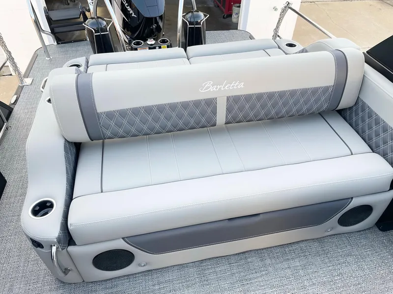 Slide: The Image of 2024 Barletta Lusso 25UCA boat with luxurious seating and integrated speakers. - 22