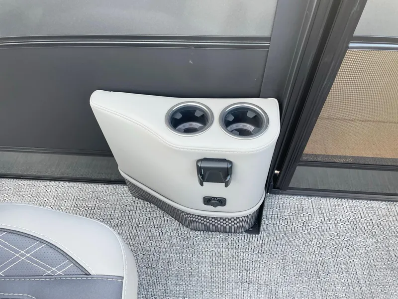 Slide: The Image of 2024 Barletta Lusso 25UCA interior cup holders and USB port. - 28