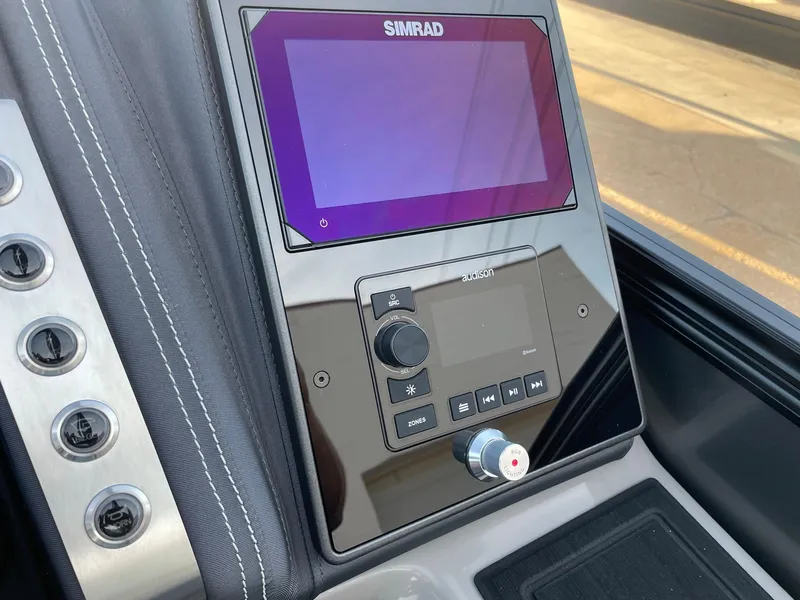 Slide: The Image of 2024 Barletta Lusso 25UCA boat dashboard with Simrad display. - 31