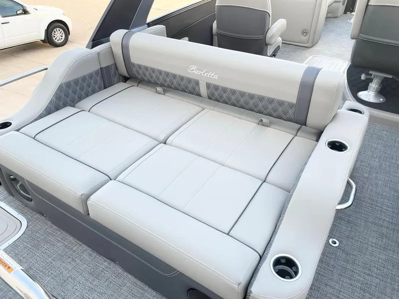 Slide: The Image of 2024 Barletta Lusso 25UCA boat with luxurious gray seating and cup holders. - 35