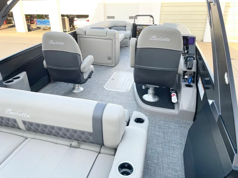 Slide: The Image of 2024 Barletta Lusso 25UCA pontoon boat interior with luxurious seating and modern design. - 39