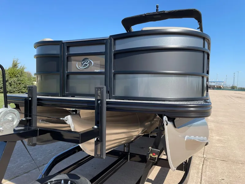 Slide: The Image of 2024 Barletta Lusso 25UCA pontoon boat on a trailer, front view. - 4