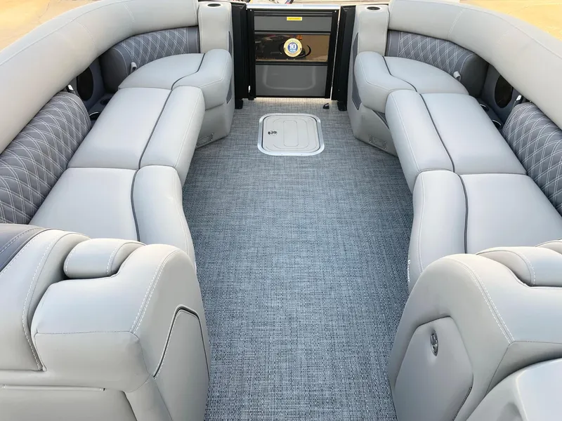 Slide: The Image of 2024 Barletta Lusso 25UCA pontoon boat with luxurious gray seating and carpeted flooring. - 42