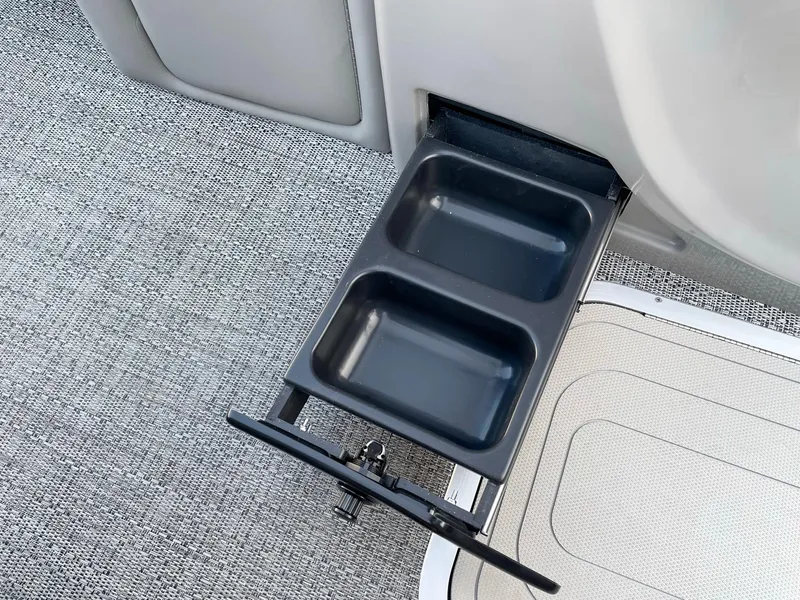 Slide: The Image of 2024 Barletta Lusso 25UCA retractable dual cup holder on gray carpeted floor. - 47