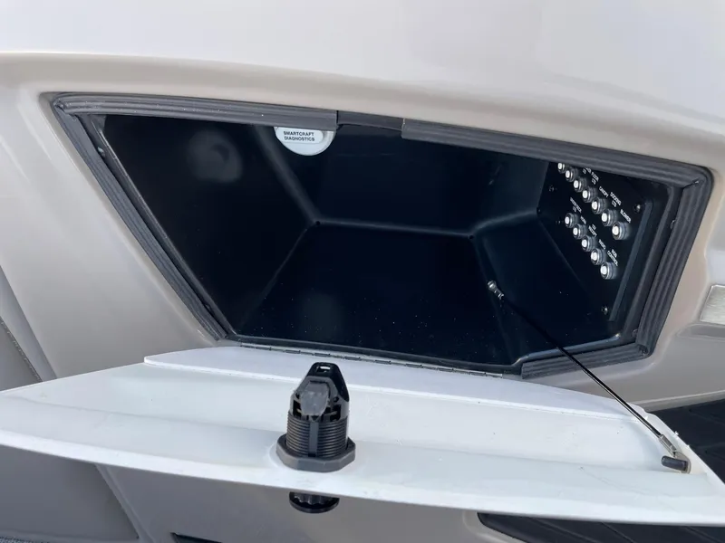 Slide: The Image of Open storage compartment on a 2024 Barletta Lusso 25UCA boat. - 48