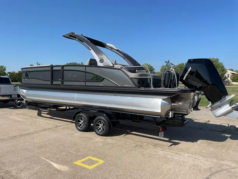 Slide: The Image of 2024 Barletta Lusso 25UCA pontoon boat on a trailer, side view. - 5