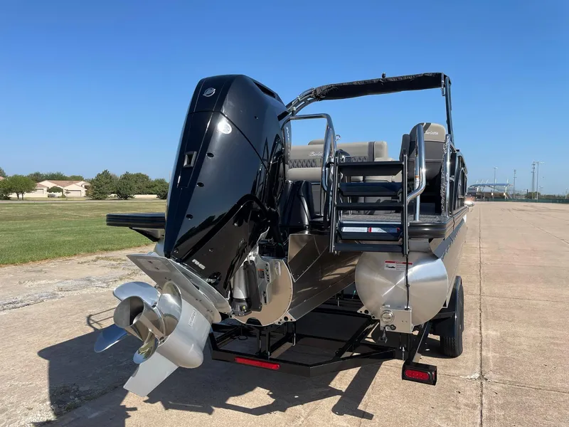 Slide: The Image of 2024 Barletta Lusso 25UCA pontoon boat rear view with outboard motor. - 8