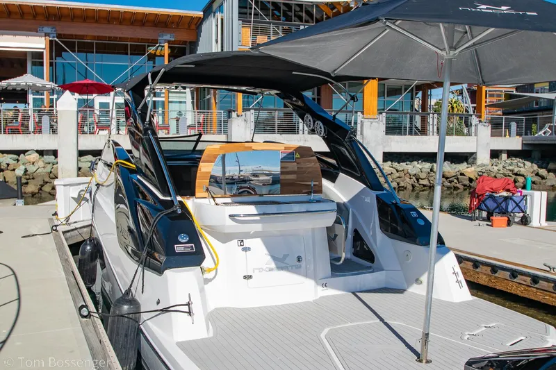 Slide: The Image of 2023 NX Boats 290 Exclusive Edition docked, showcasing sleek design and modern features. - 11