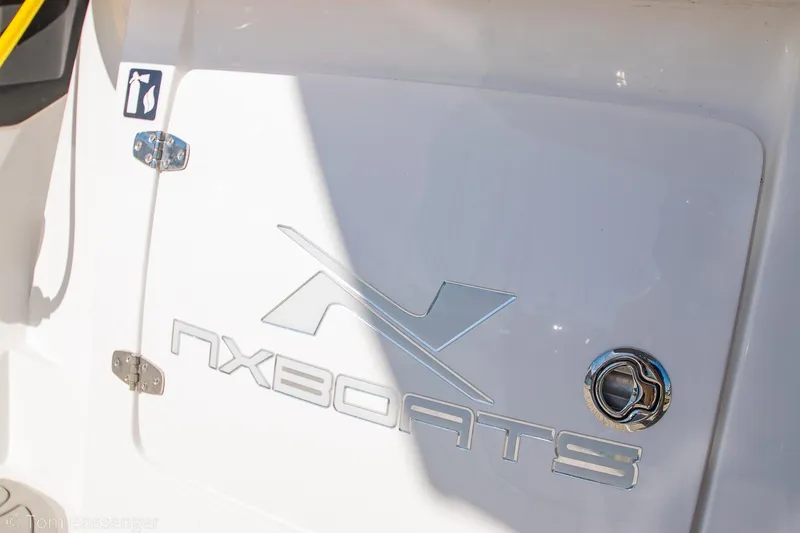 Slide: The Image of 2023 NX Boats 290 Exclusive Edition logo on white surface. - 14