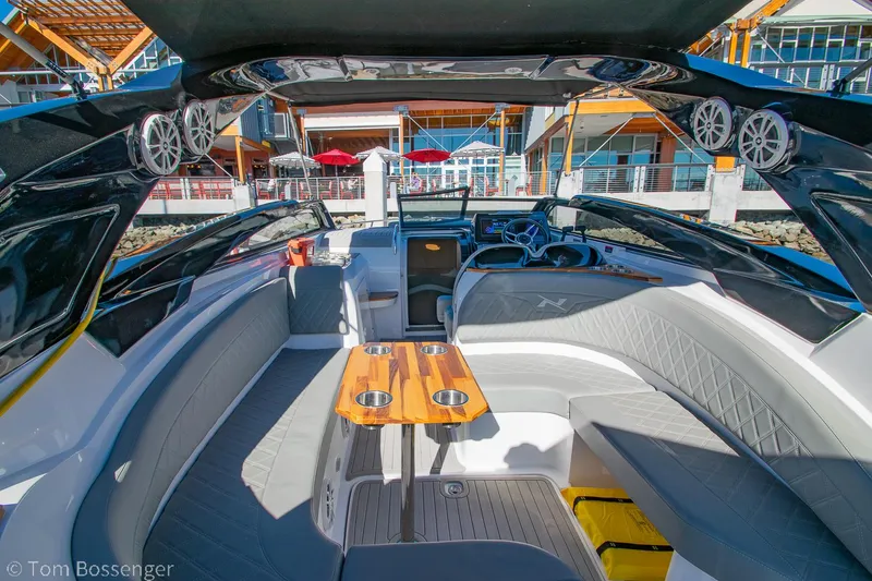 Slide: The Image of 2023 NX Boats 290 Exclusive Edition interior with sleek seating and modern dashboard. - 15