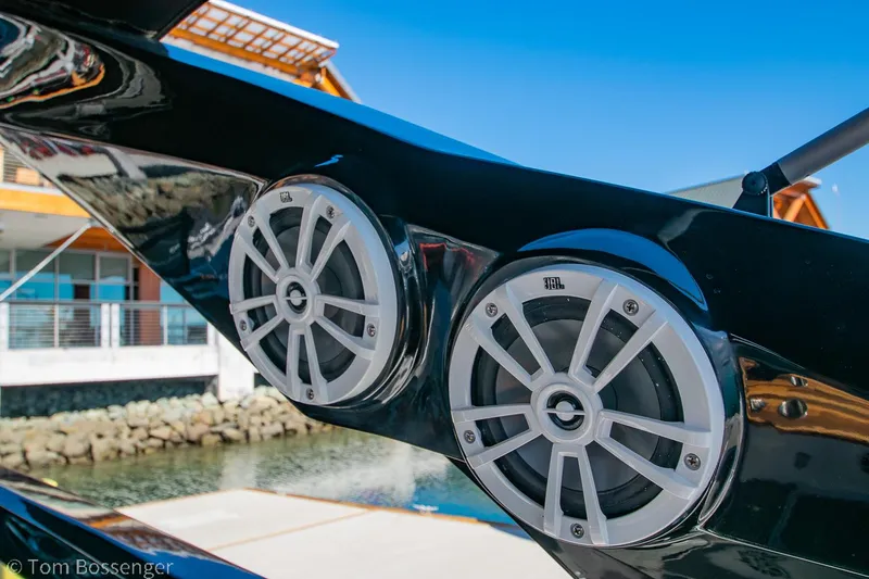 Slide: The Image of Speakers on NX Boats 290 Exclusive Edition, 2023 model, with waterfront background. - 20